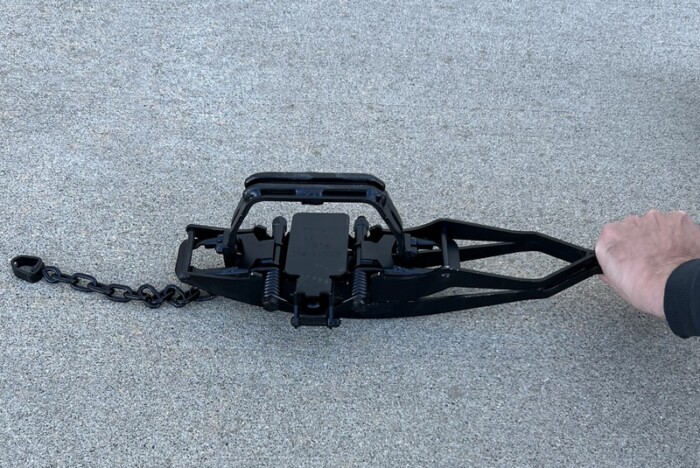 Compress Trap Levers using Top Piece of Setter. Trap Sold Separate.